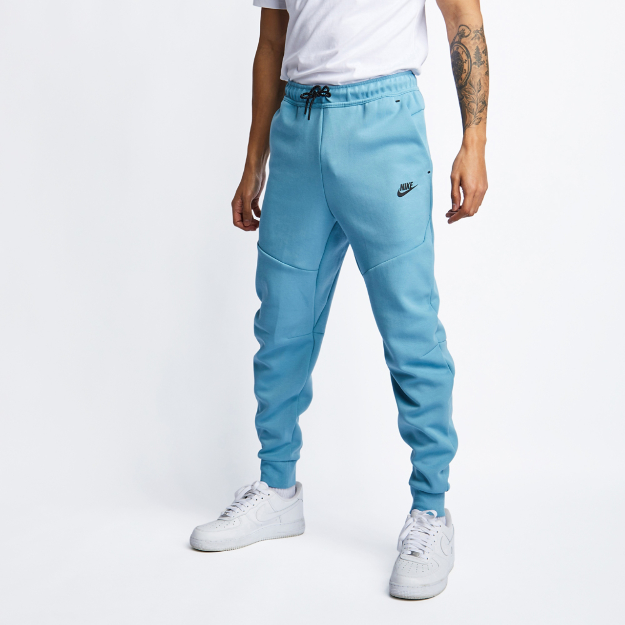 Nike Tech Fleece Cuffed Image 1 of 4. Tap to open photo gallery.