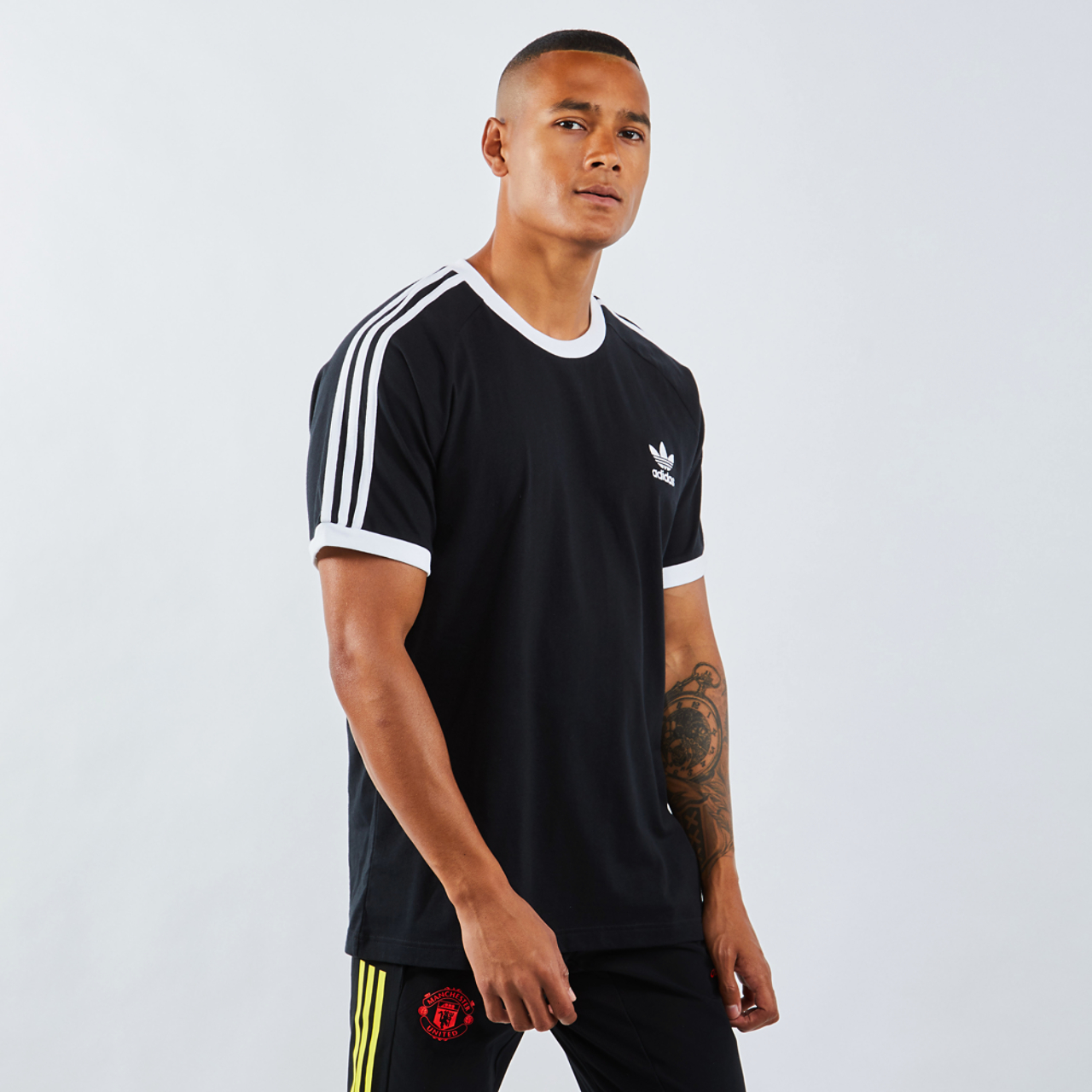adidas Adicolor 3-Stripesshortsleeve Image 1 of 4. Tap to open photo gallery.