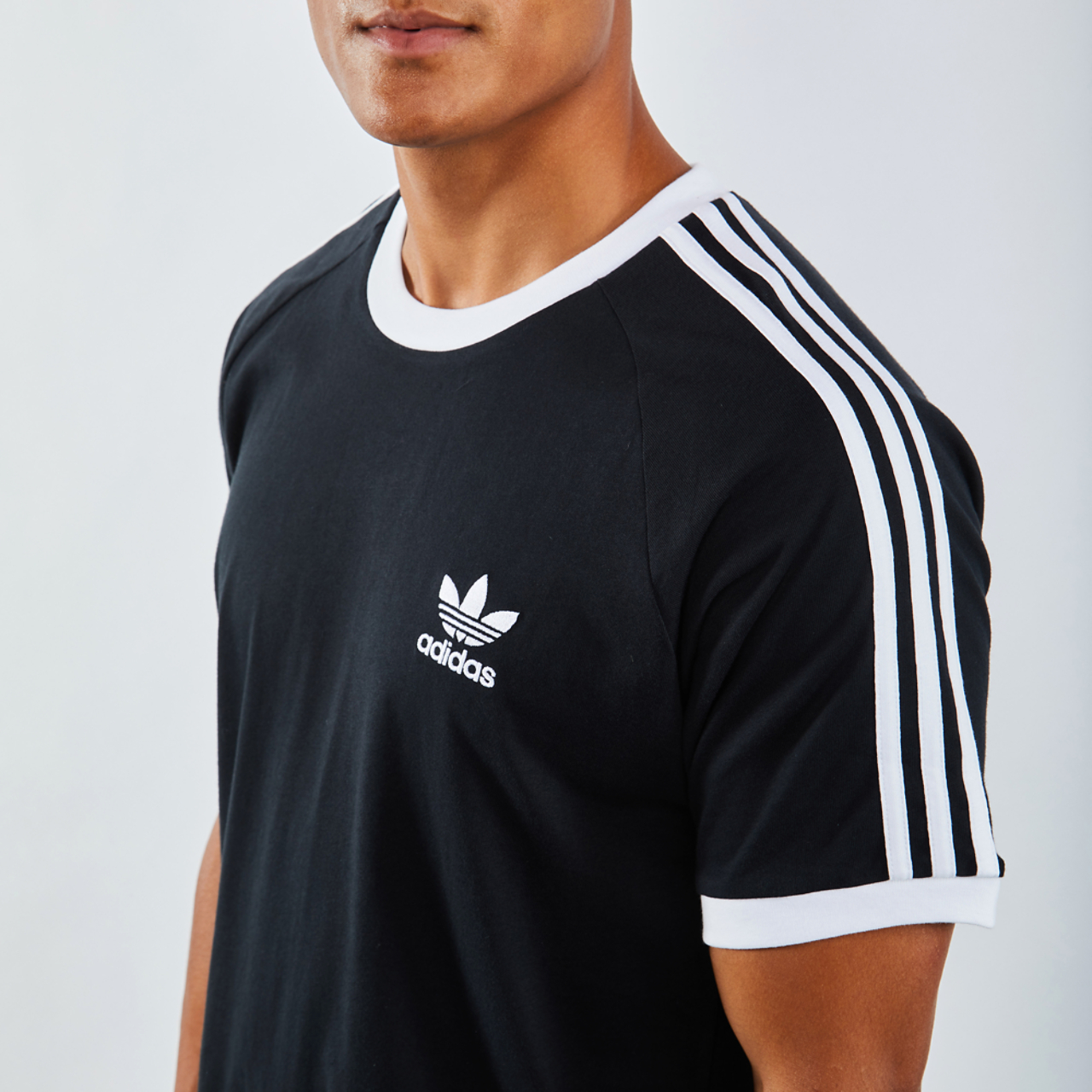 adidas Adicolor 3-Stripesshortsleeve Image 4 of 4. Tap to open photo gallery.
