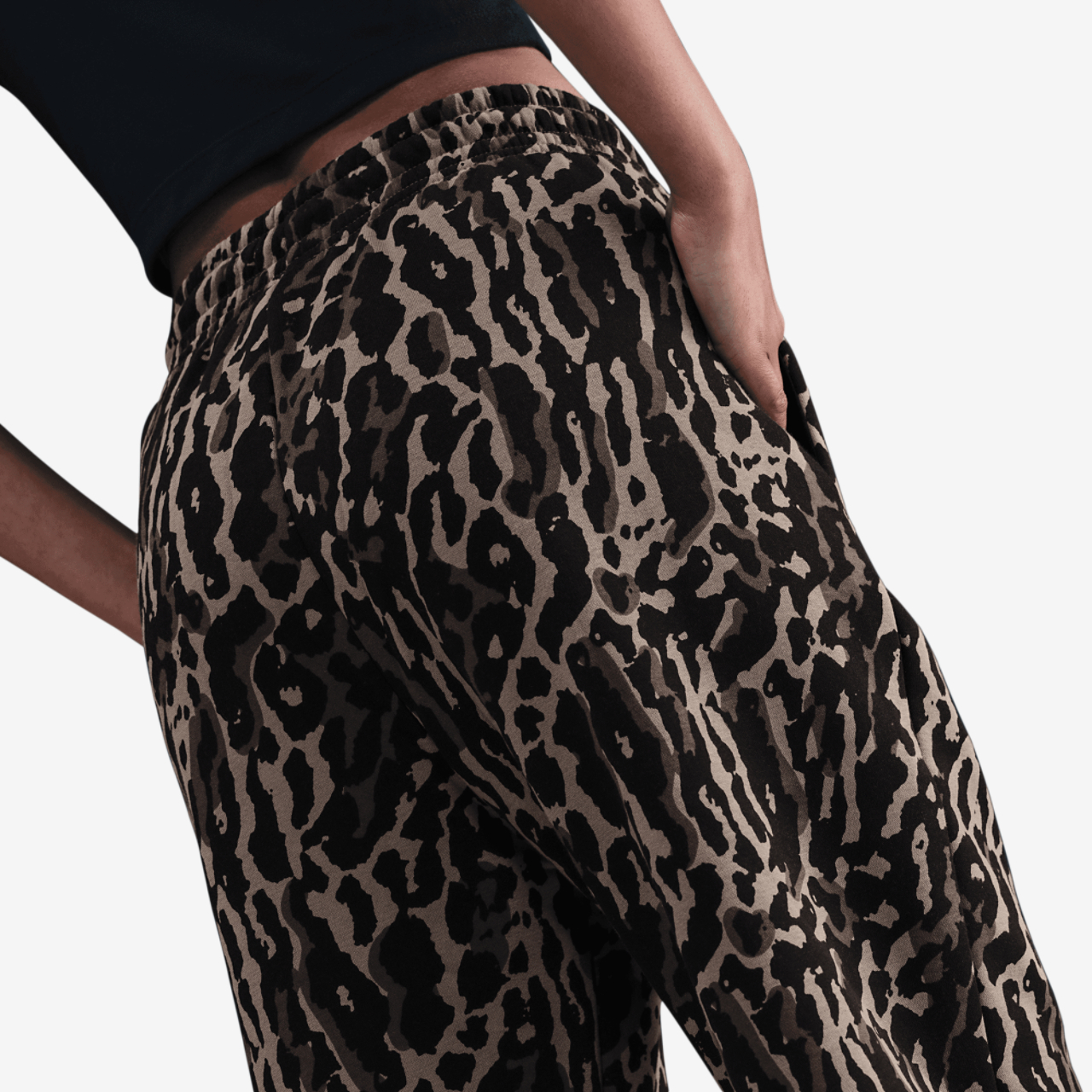 Nike NSW Phoenix Fleece All Over Print Pants Image 2 of 6. Tap to open photo gallery.