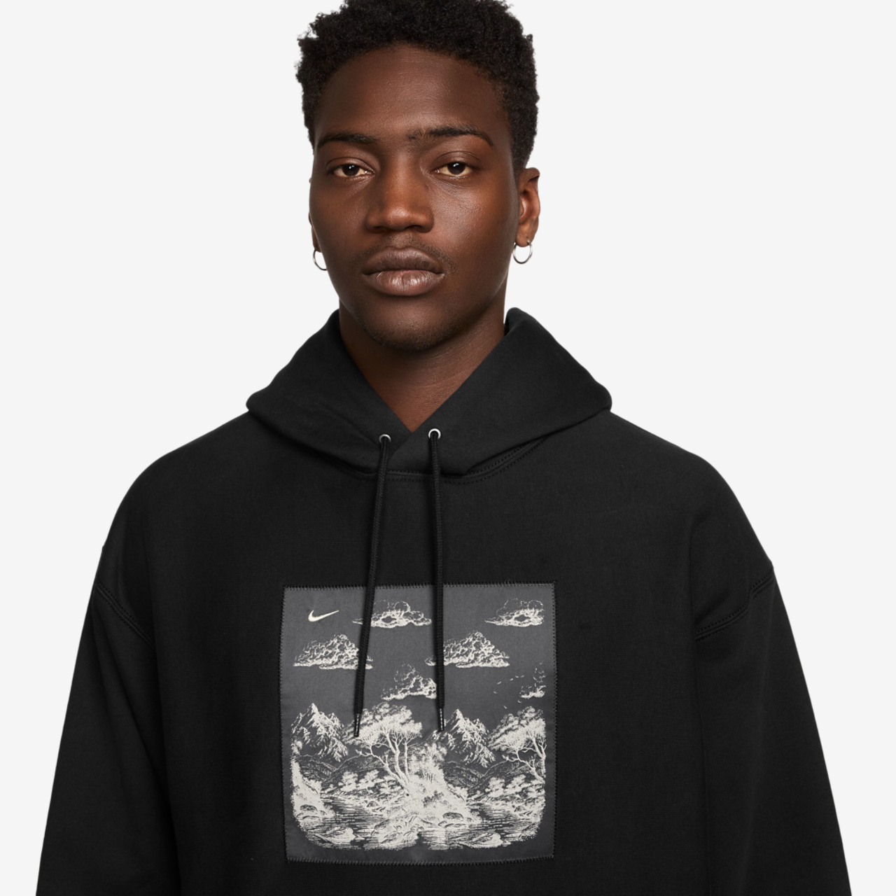 Nike NL Solo Swoosh Pullover Hood Gfx Image 3 of 3. Tap to open photo gallery.