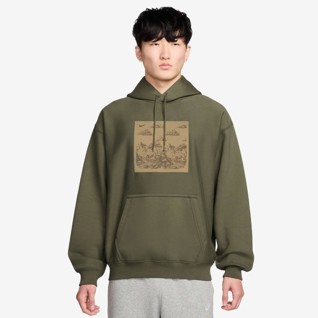Nike NL Solo Swoosh Pullover Hood Gfx Image 1 of 3. Tap to open photo gallery.