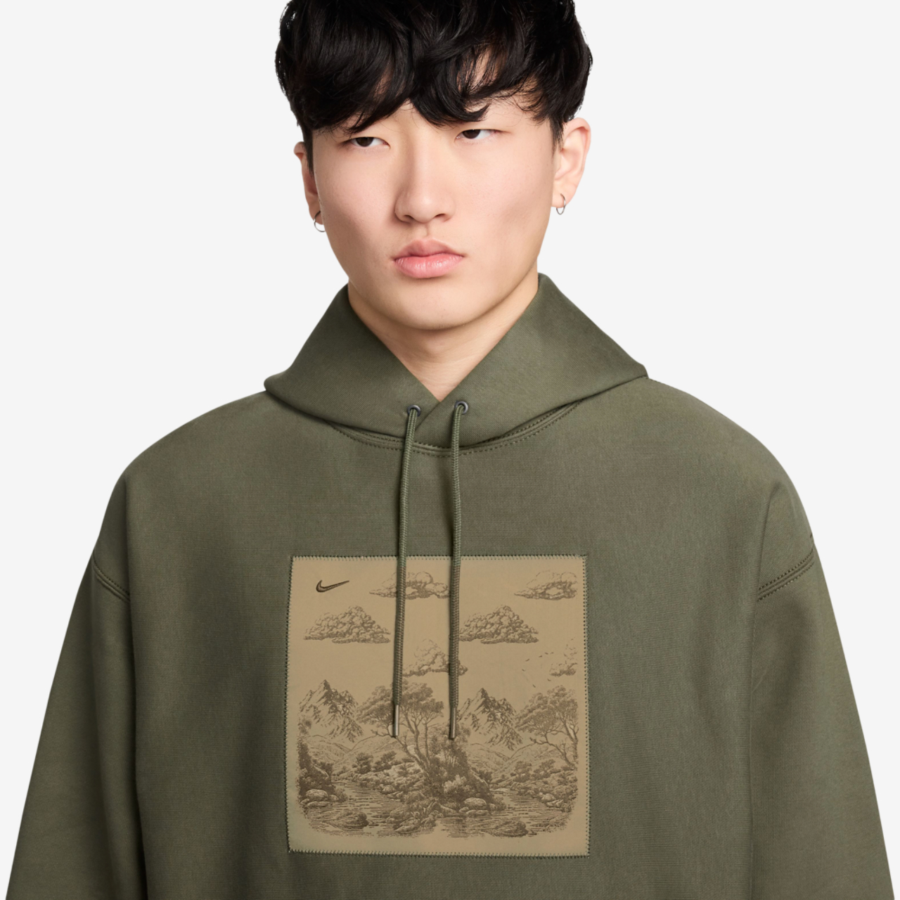 Nike NL Solo Swoosh Pullover Hood Gfx Image 3 of 3. Tap to open photo gallery.
