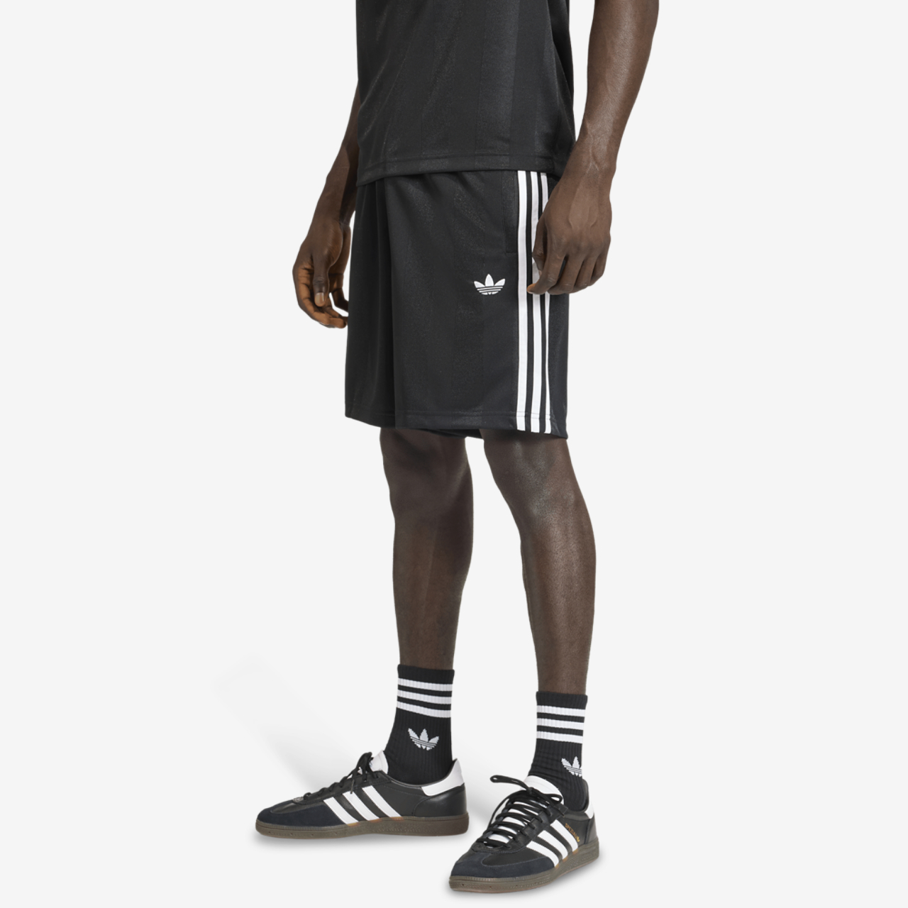 adidas 3 Stripes Loose Engineered Shorts 8" Image 1 of 4. Tap to open photo gallery.