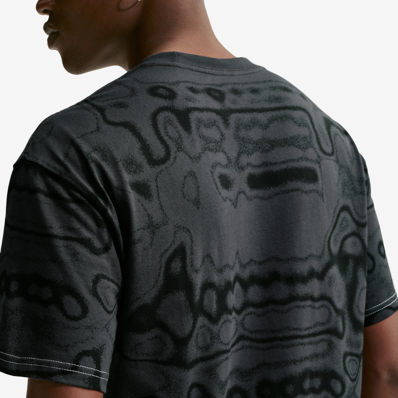 Nike NSW AM Day AOP Loose Tee Image 2 of 4. Tap to open photo gallery.