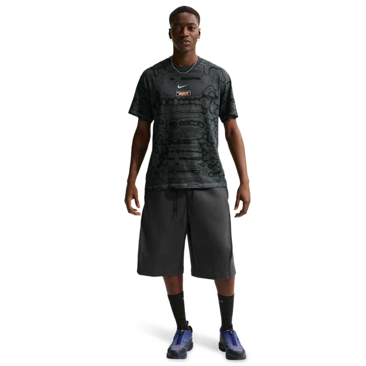 Nike NSW AM Day AOP Loose Tee Image 3 of 4. Tap to open photo gallery.