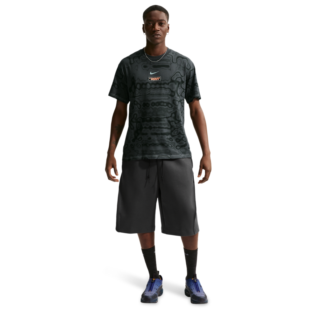 Nike NSW AM Day AOP Loose Tee Image 3 of 4. Tap to open photo gallery.