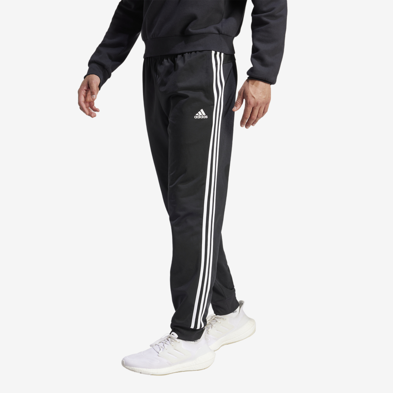 adidas Essentials Warm-Up Tapered 3-Stripes Track Pants Image 1 of 5. Tap to open photo gallery.