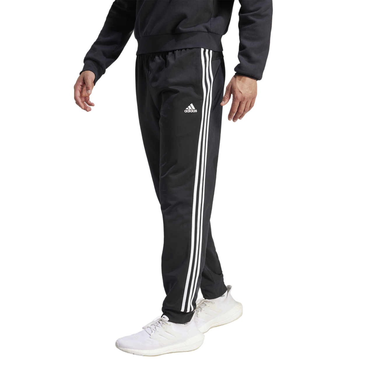 adidas Essentials Warm-Up Tapered 3-Stripes Track Pants Image 1 of 5. Tap to open photo gallery.