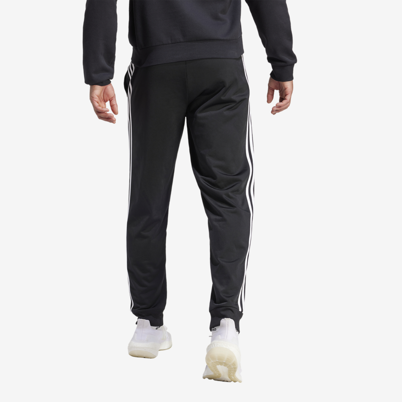 adidas Essentials Warm-Up Tapered 3-Stripes Track Pants Image 2 of 5. Tap to open photo gallery.