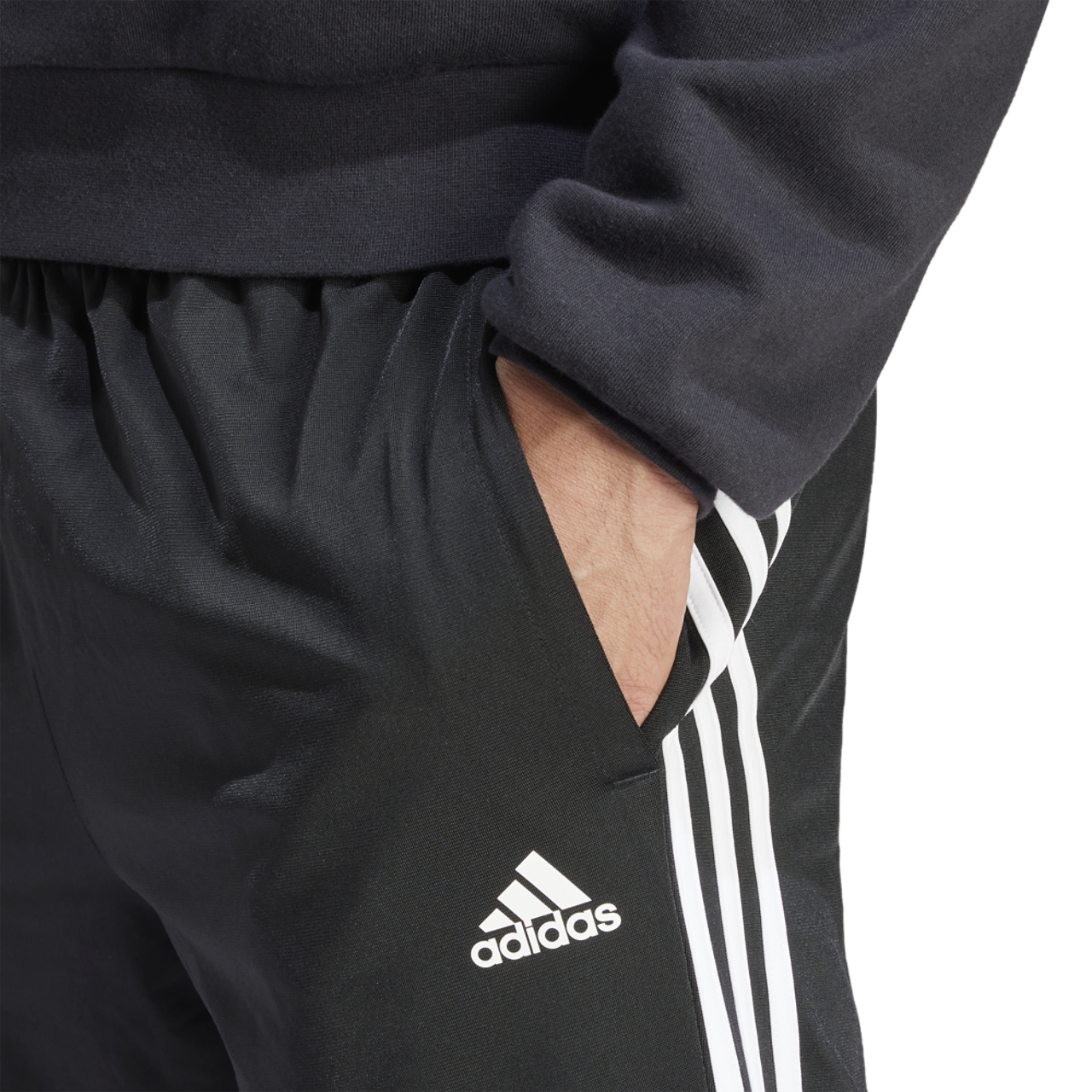 adidas Essentials Warm-Up Tapered 3-Stripes Track Pants Image 3 of 5. Tap to open photo gallery.