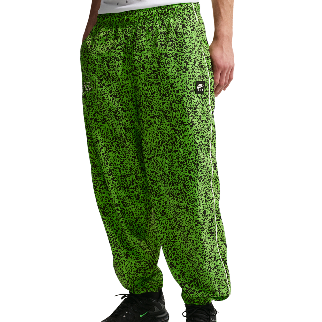 Nike Air Woven AOP TL Pants Image 1 of 5. Tap to open photo gallery.