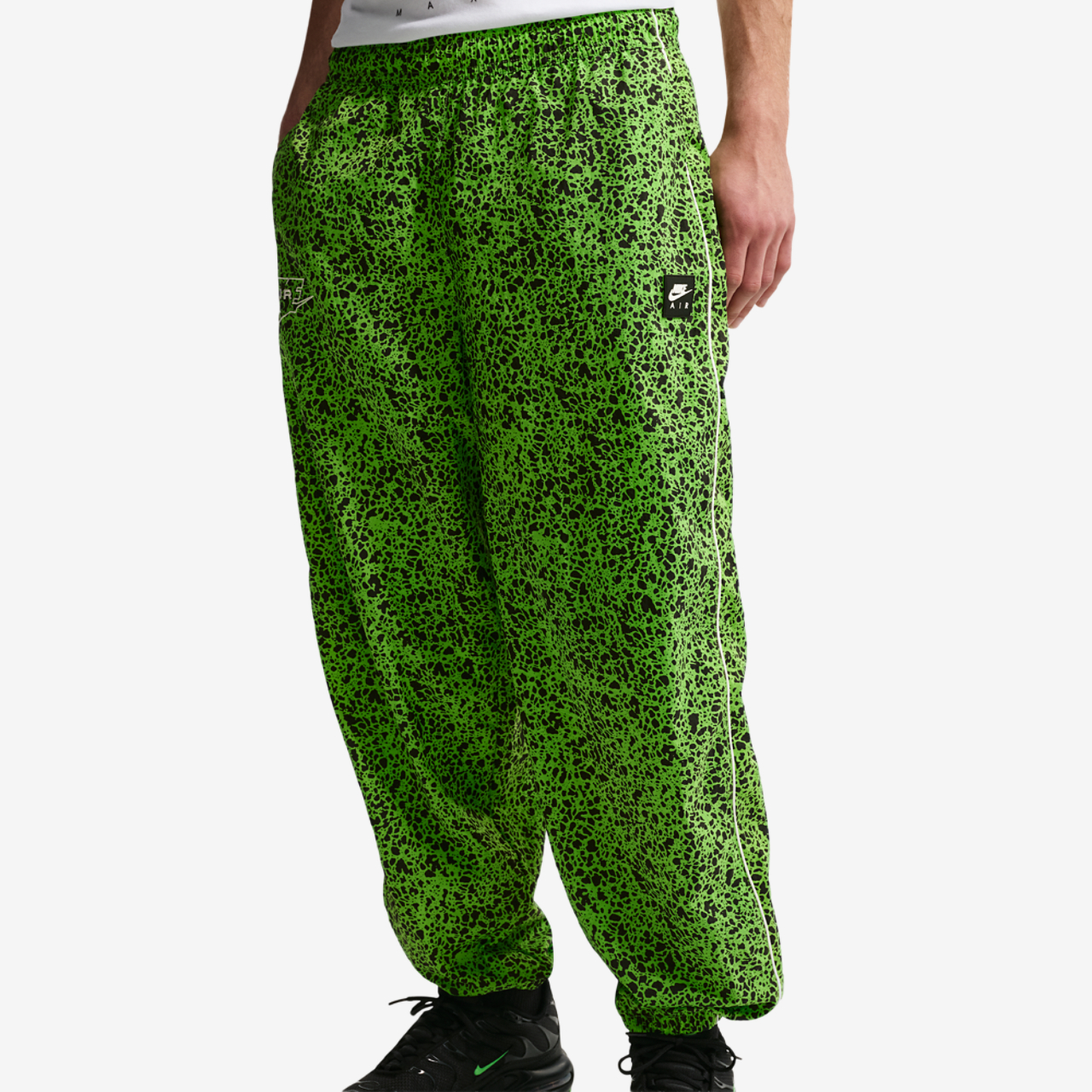 Nike Air Woven AOP TL Pants Image 1 of 5. Tap to open photo gallery.