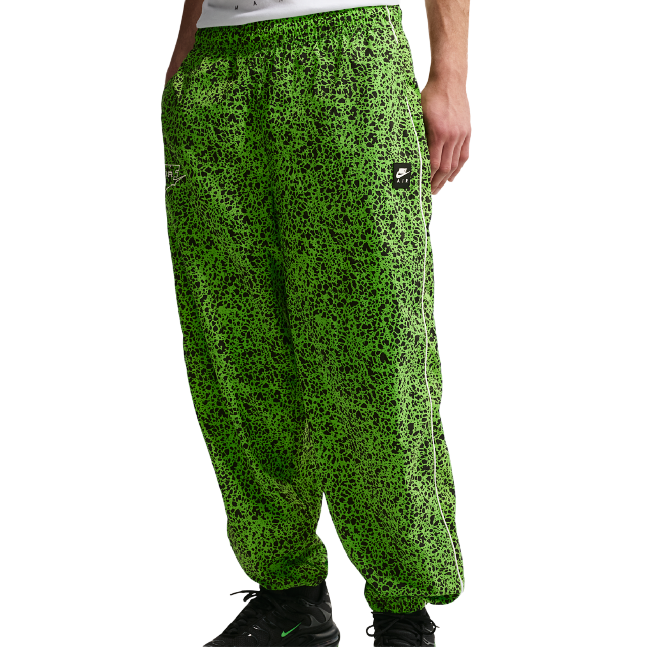 Nike Air Woven AOP TL Pants Image 1 of 5. Tap to open photo gallery.