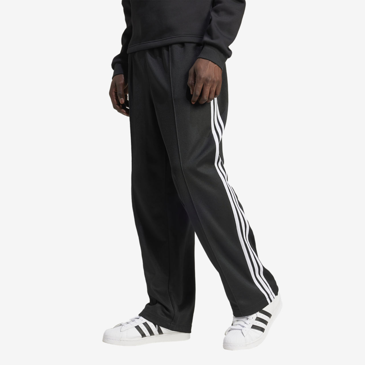 adidas Originals Firebird Adicolor Baggy Track Pants Image 1 of 5. Tap to open photo gallery.