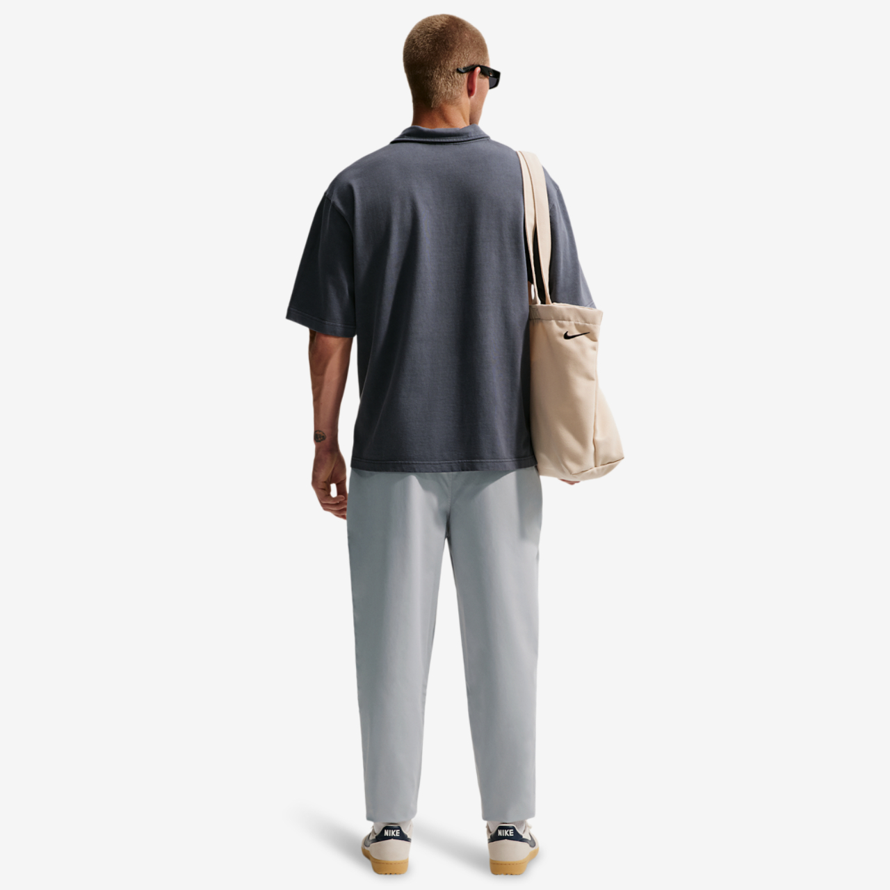 Nike Club Woven Tapered Pants Image 4 of 4. Tap to open photo gallery.