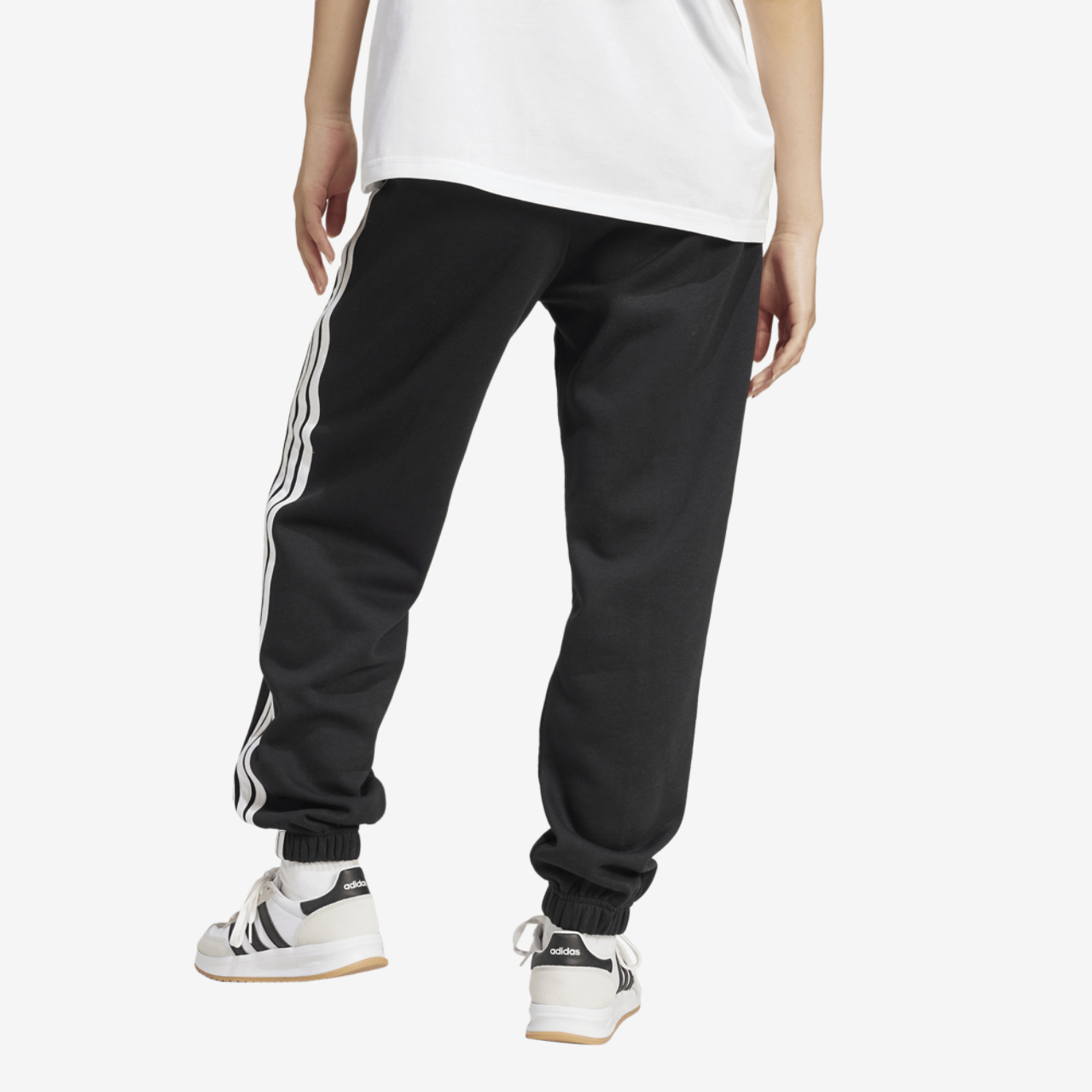 adidas Essentials 3-Stripes Fleece Loose Pants Image 2 of 5. Tap to open photo gallery.