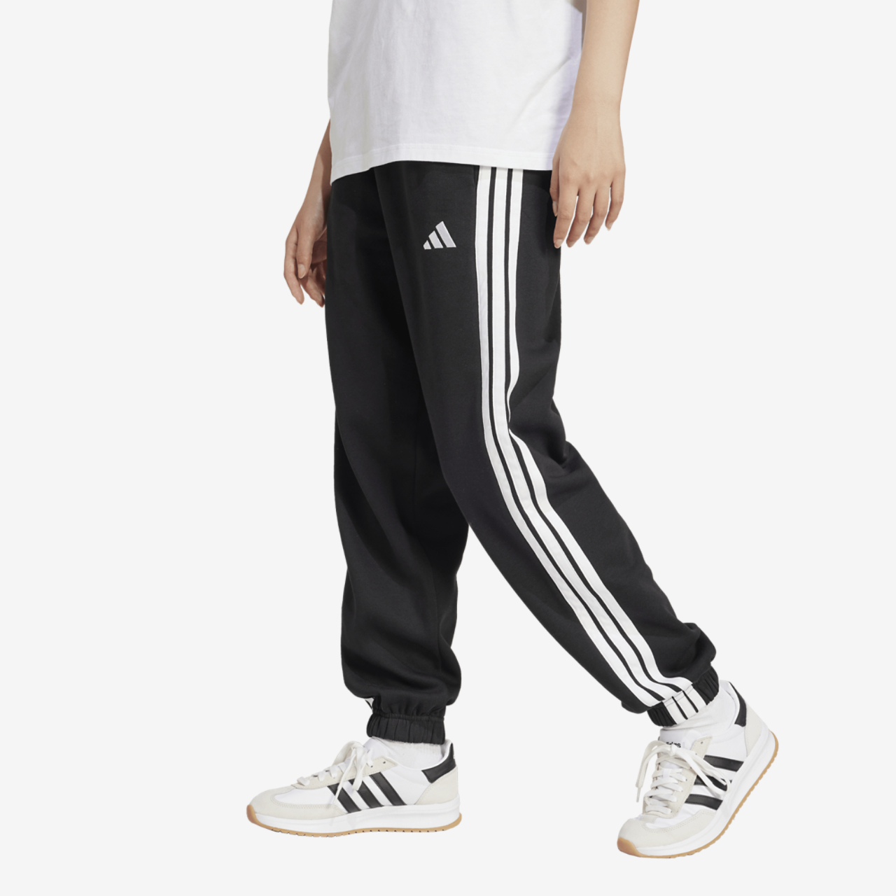 adidas Essentials 3-Stripes Fleece Loose Pants Image 3 of 5. Tap to open photo gallery.