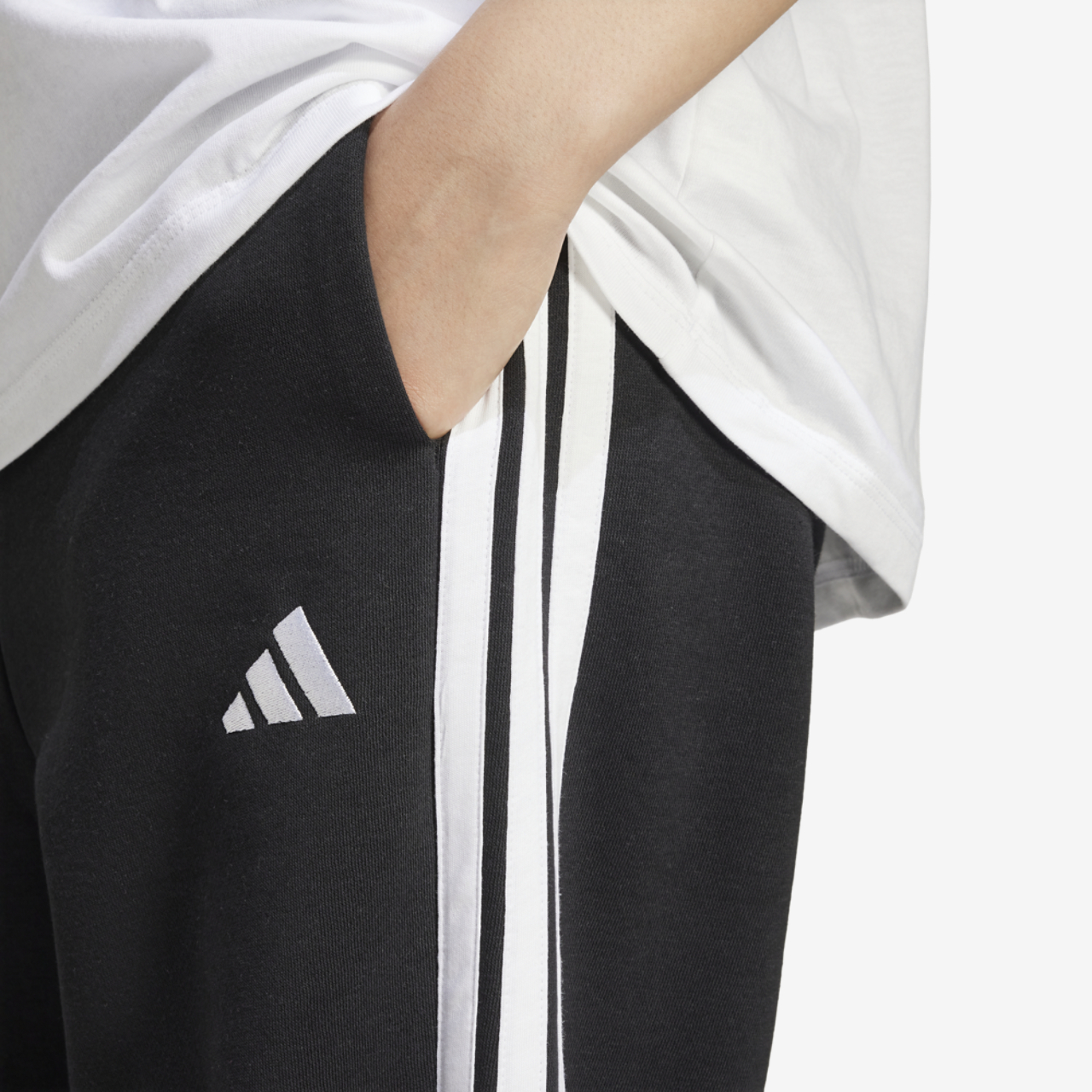 adidas Essentials 3-Stripes Fleece Loose Pants Image 4 of 5. Tap to open photo gallery.