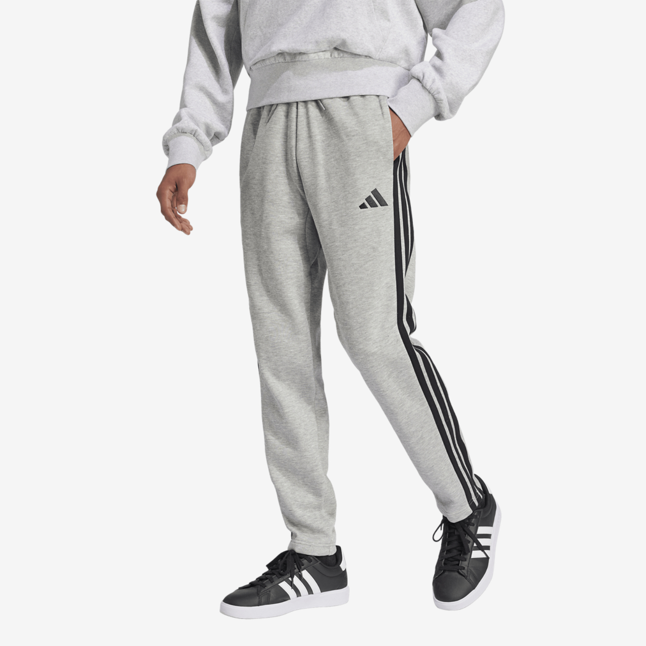 adidas Essentials 3-Stripes Fleece Open Hem Pants Image 1 of 6. Tap to open photo gallery.