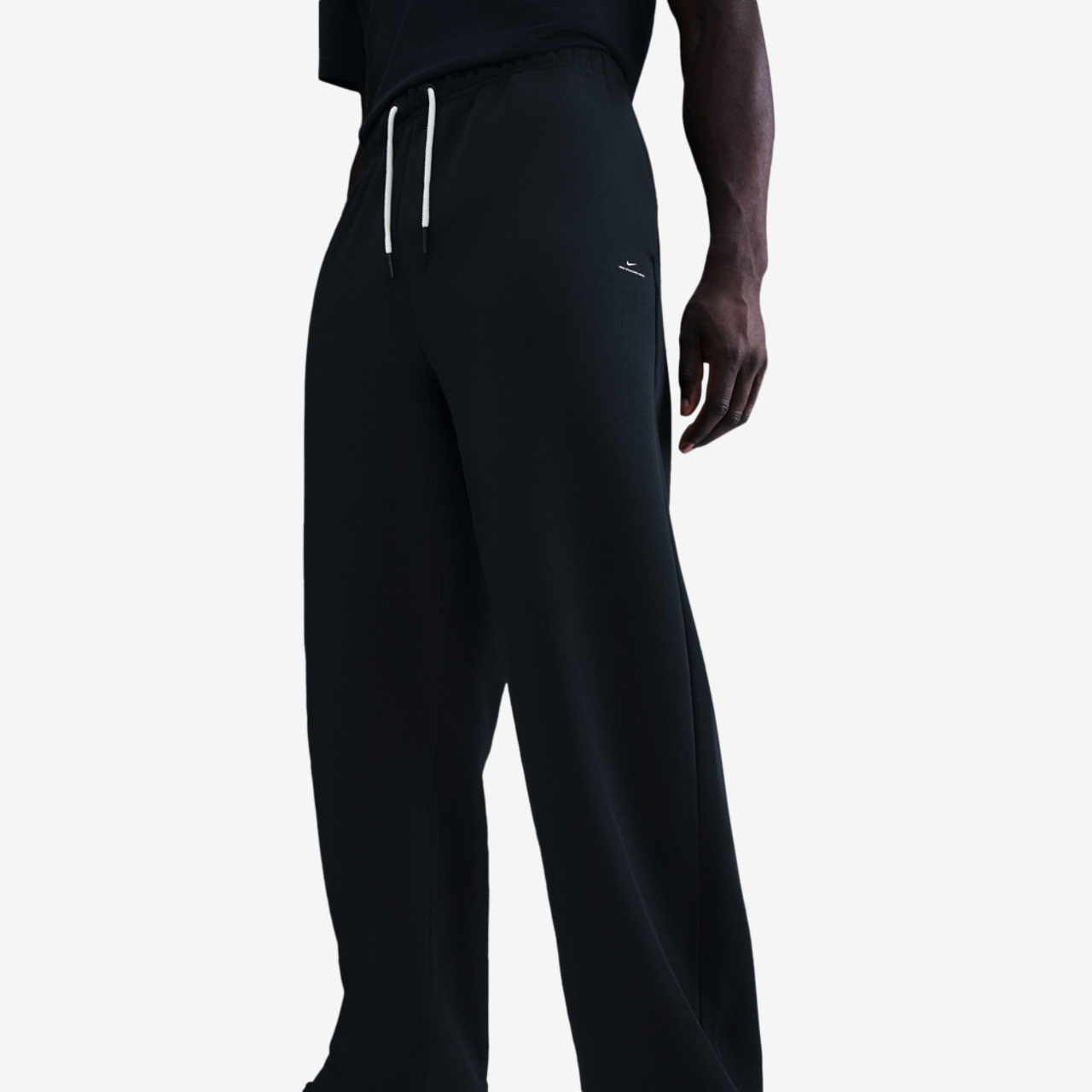 Nike Standard Issue Brushed Open Hem Pants Image 1 of 2. Tap to open photo gallery.