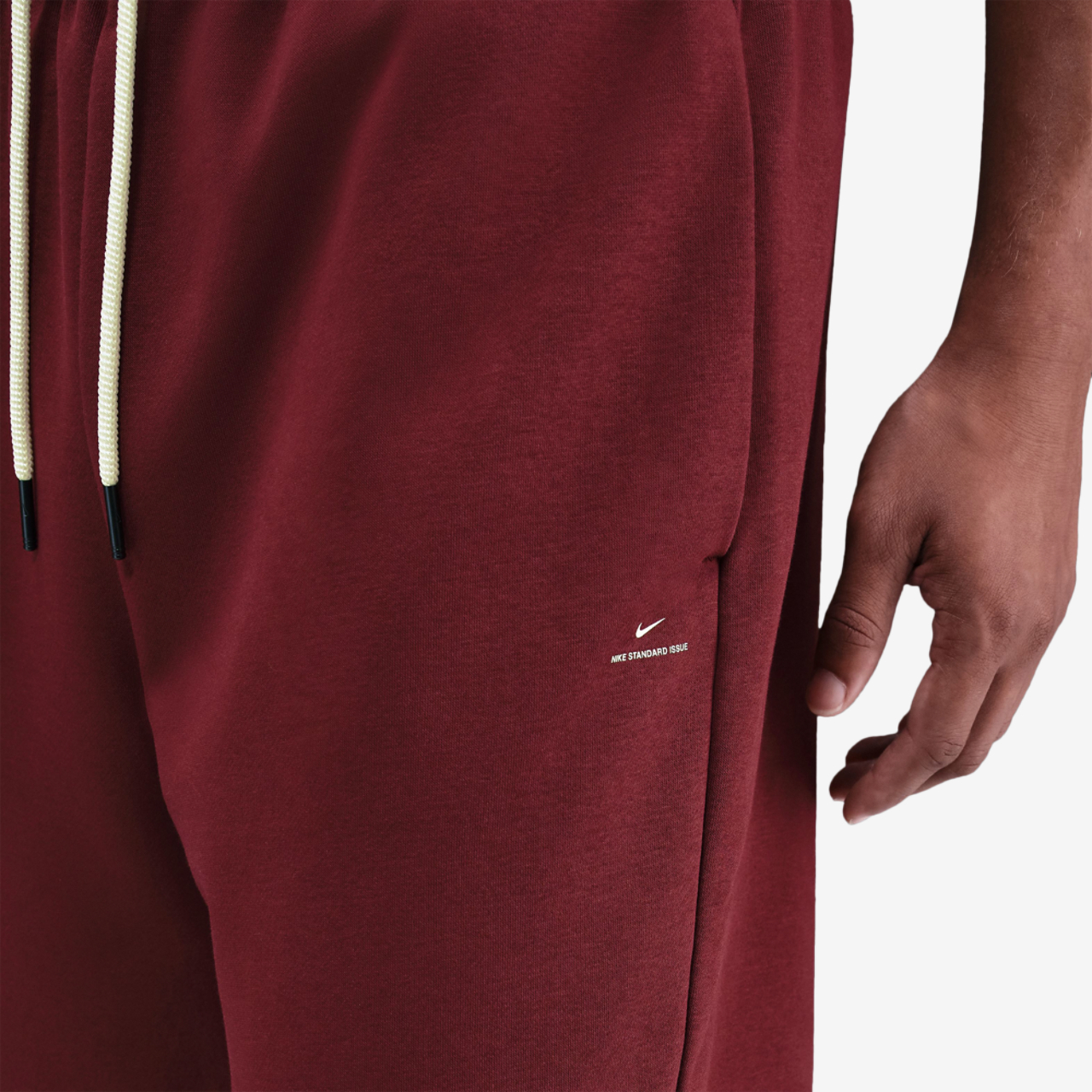 Nike Standard Issue Brushed Open Hem Pants Image 3 of 3. Tap to open photo gallery.