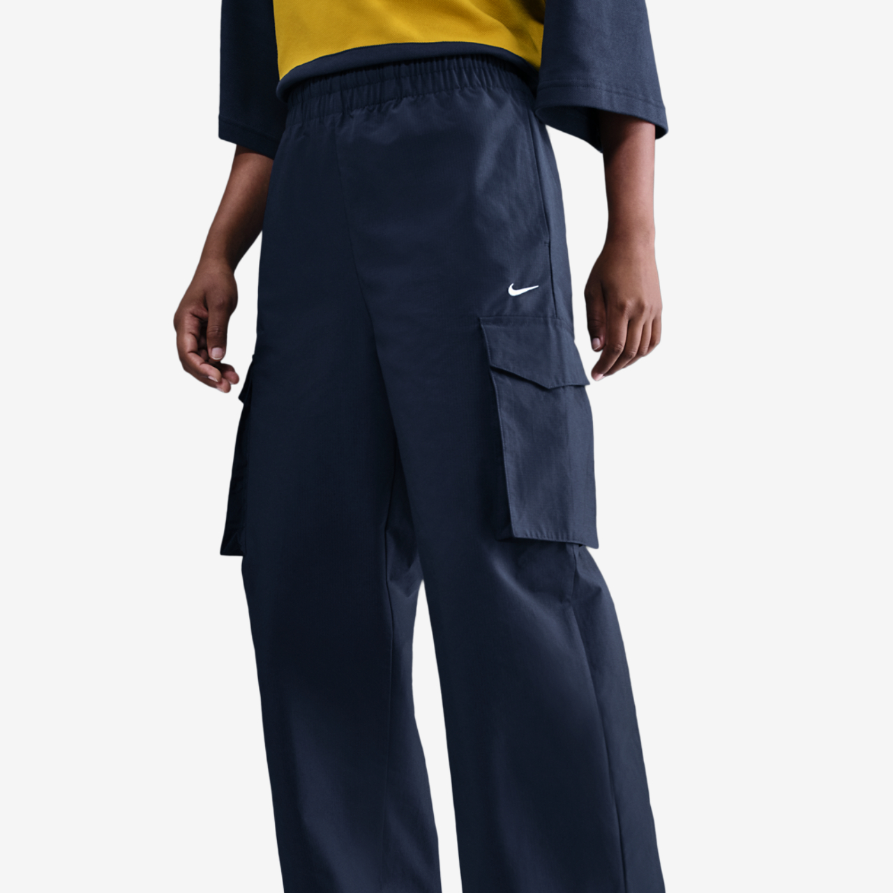 Nike NSW EVRTHNG Woven Mid Rise Cargo Pants Image 1 of 5. Tap to open photo gallery.