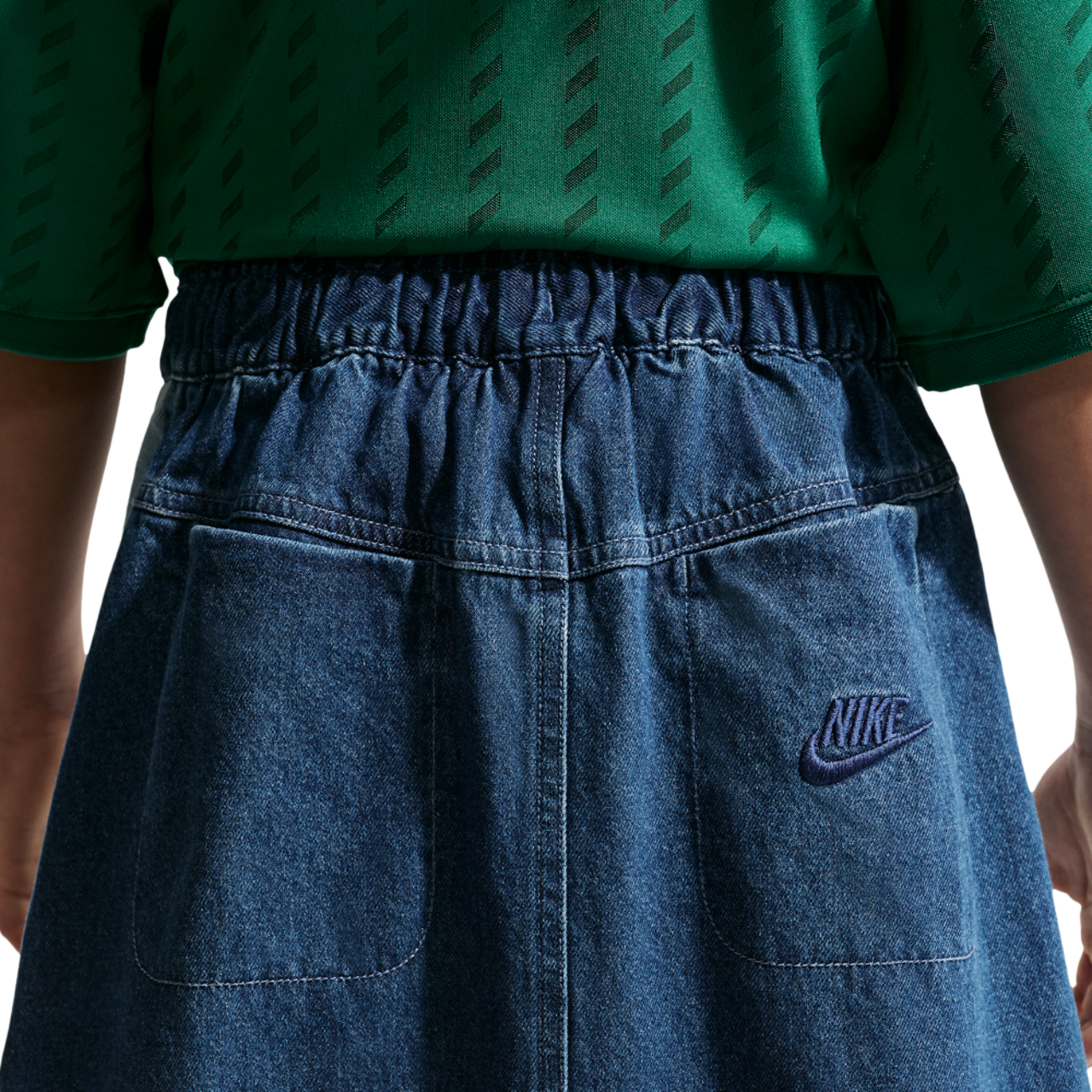 Nike NSW CLN Denim Mini Skirt Image 2 of 4. Tap to open photo gallery.
