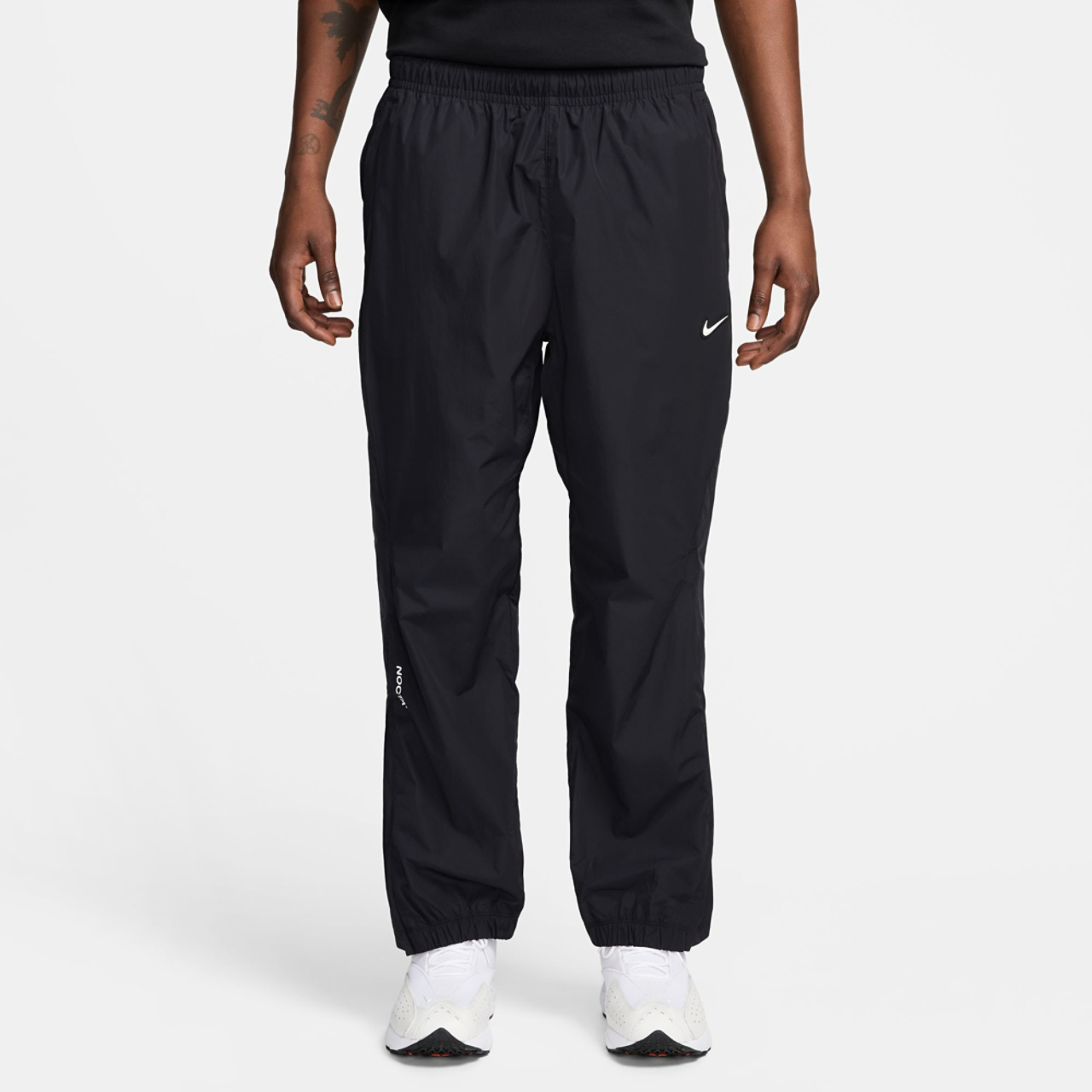 Nike  NRG NOCTA Woven Track Pants Image 1 of 2. Tap to open photo gallery.