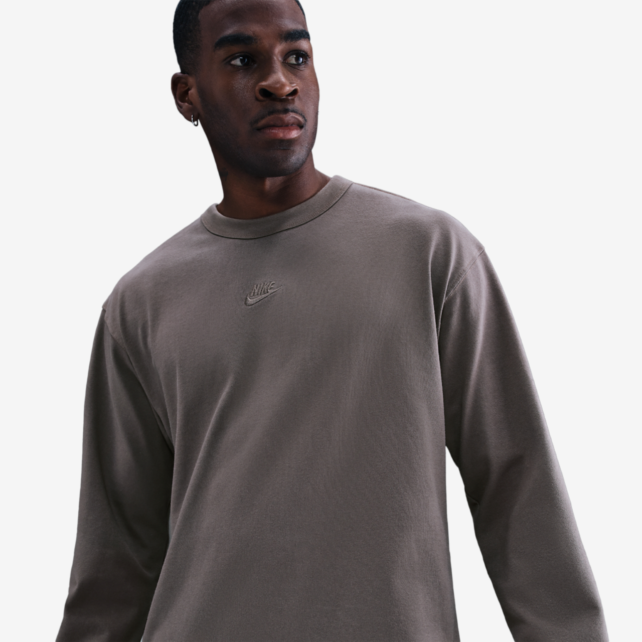 Nike Premium Essentials Long Sleeve SUST T-Shirt Image 1 of 4. Tap to open photo gallery.