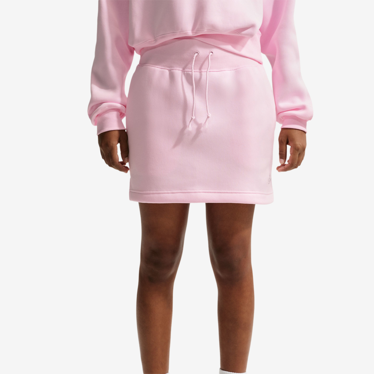 Nike NSW Phoenix Fleece HR Bling Mini Skirt Image 1 of 3. Tap to open photo gallery.