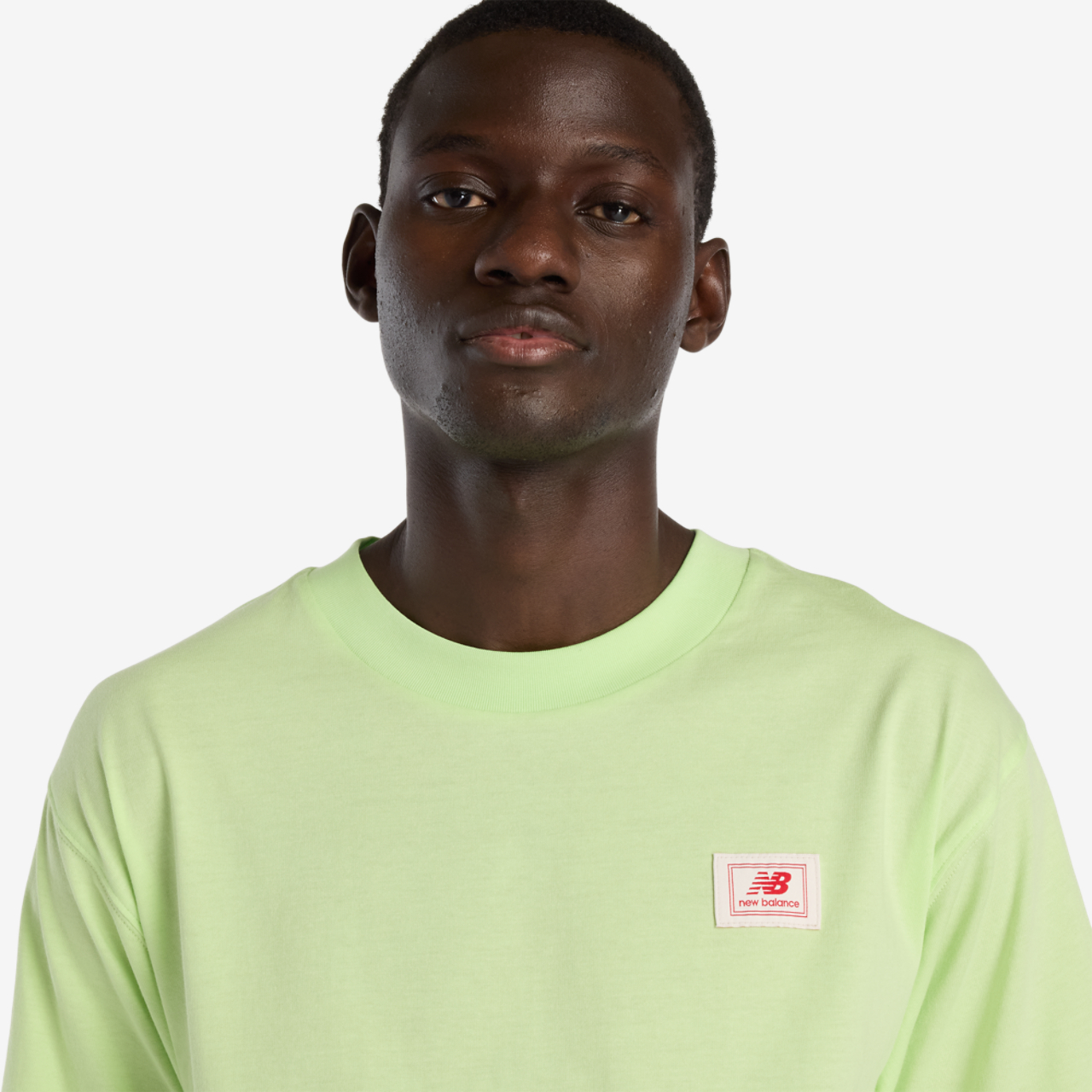 New Balance Woven Label T-Shirt Image 1 of 2. Tap to open photo gallery.