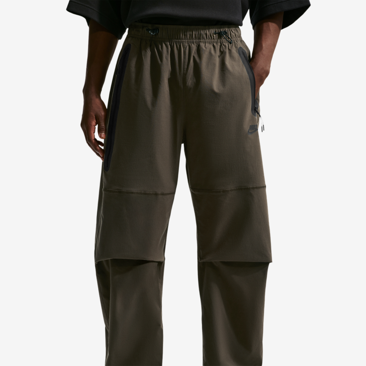 Nike Drifit Tech Woven Pant Image 1 of 4. Tap to open photo gallery.