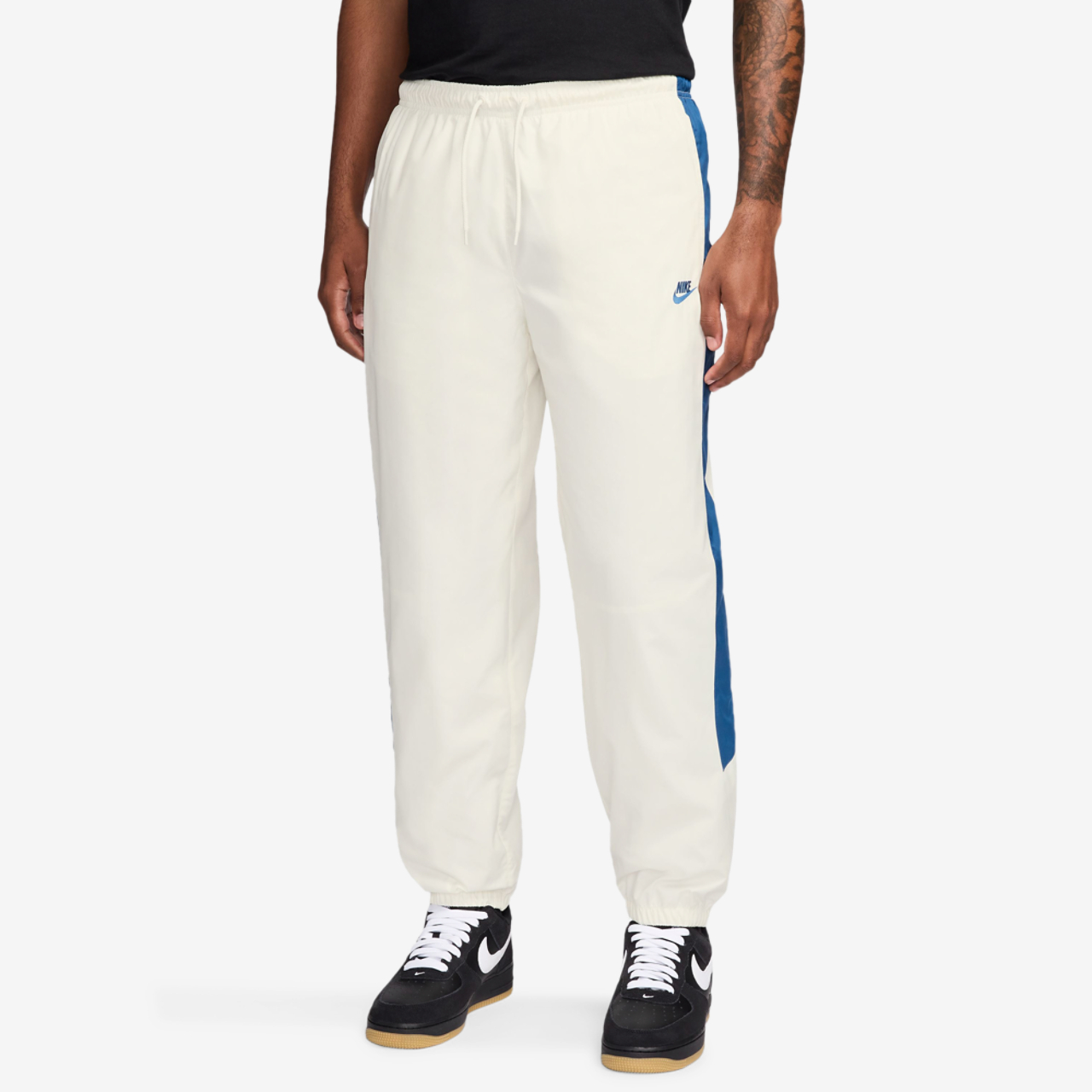 Nike NSW Windrunner Pants Image 1 of 3. Tap to open photo gallery.