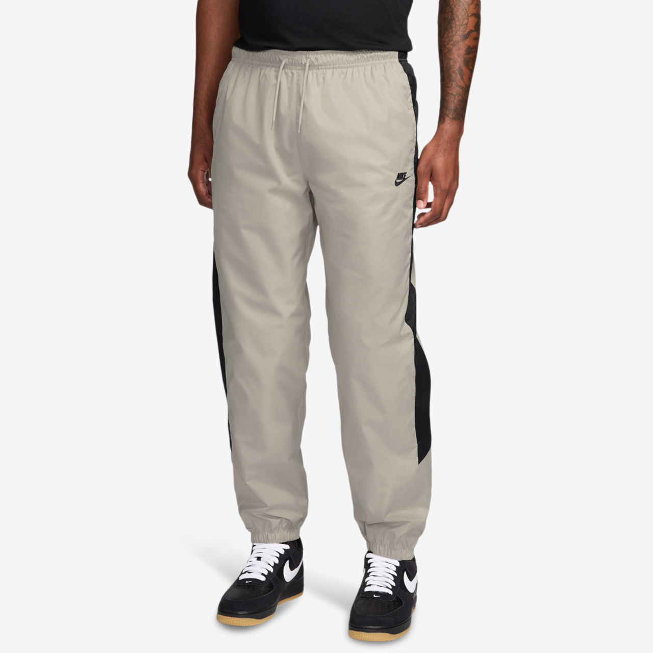 Nike NSW Windrunner Pants Image 1 of 3. Tap to open photo gallery.