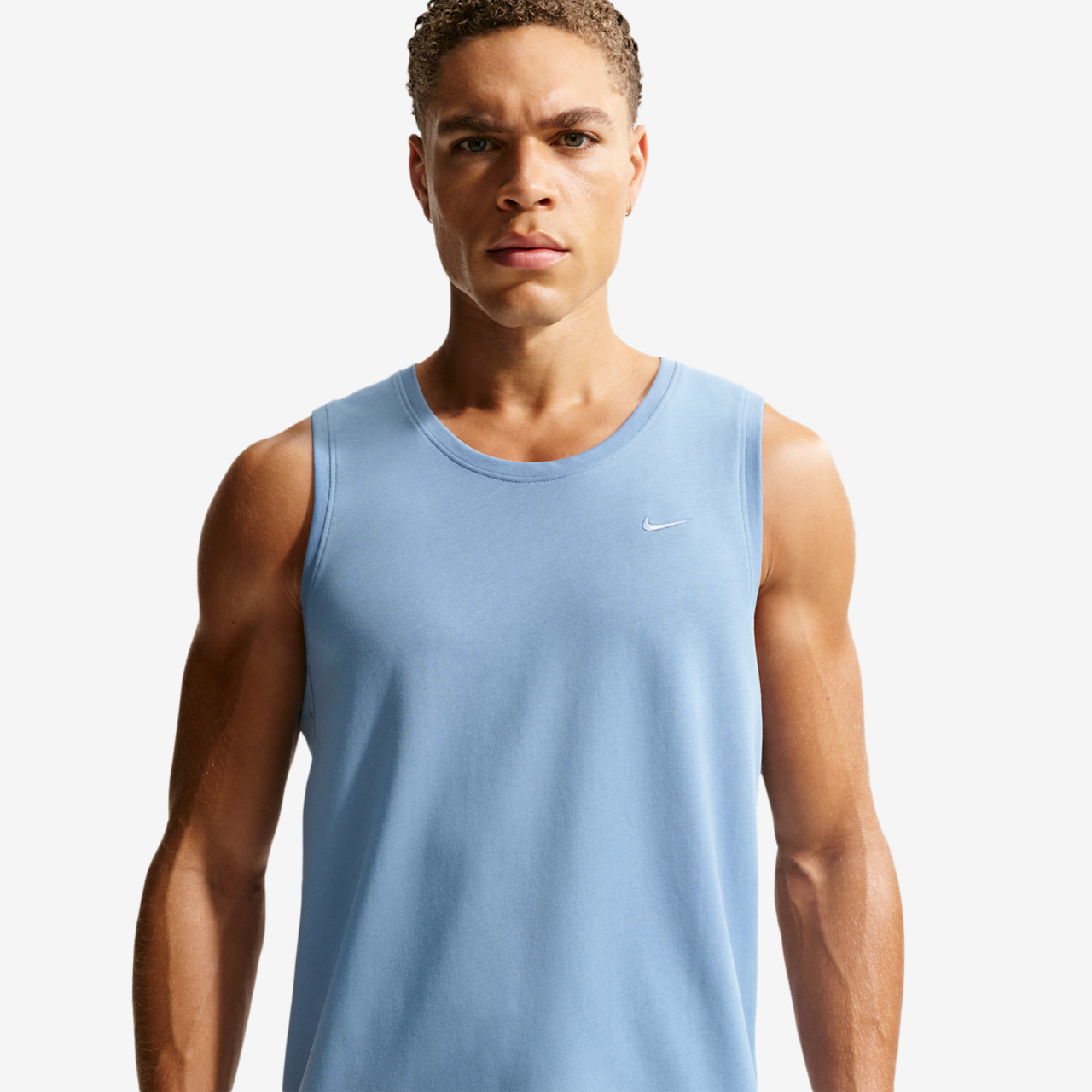 Nike Dri-FIT Primary Statement Tank Image 1 of 5. Tap to open photo gallery.