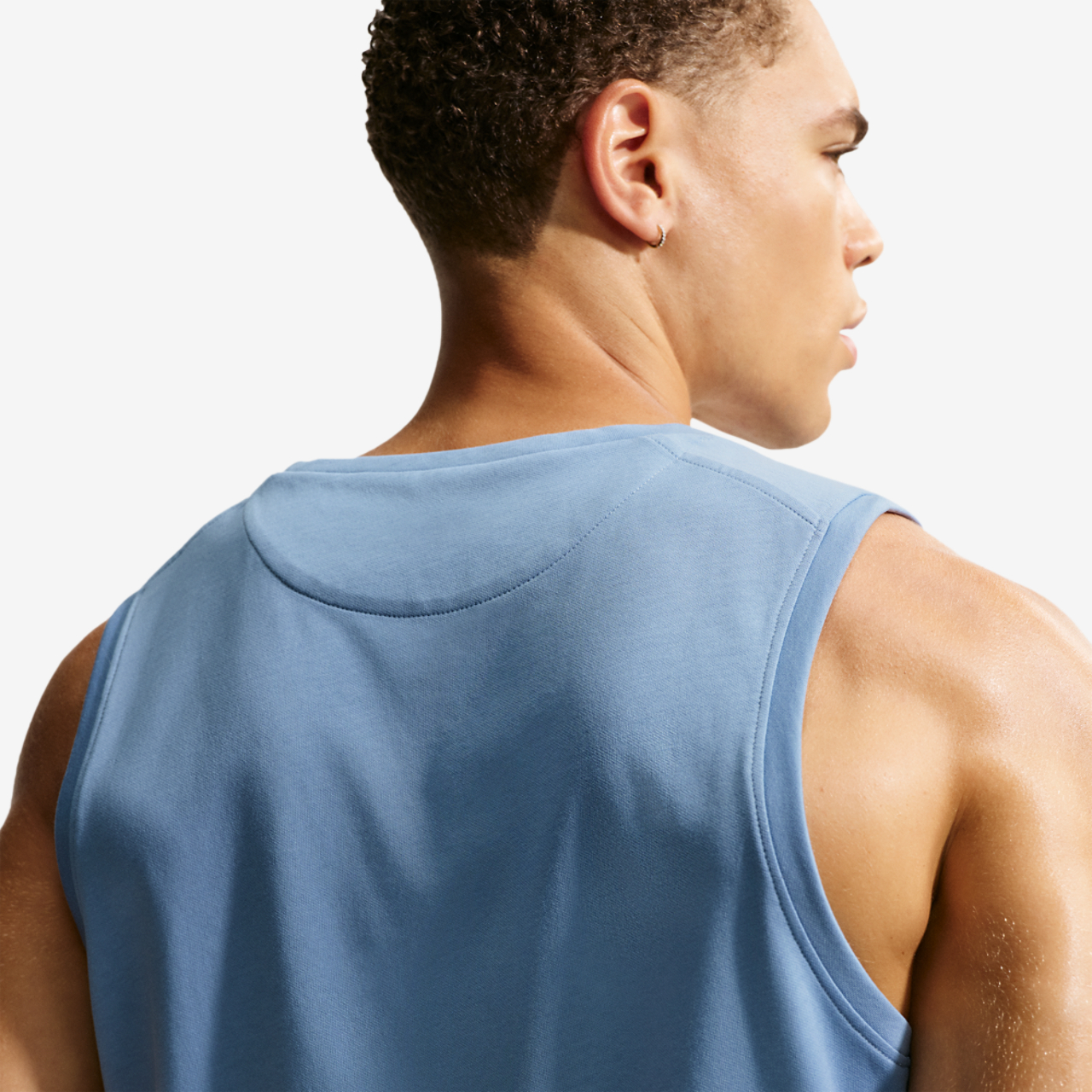 Nike Dri-FIT Primary Statement Tank Image 2 of 5. Tap to open photo gallery.