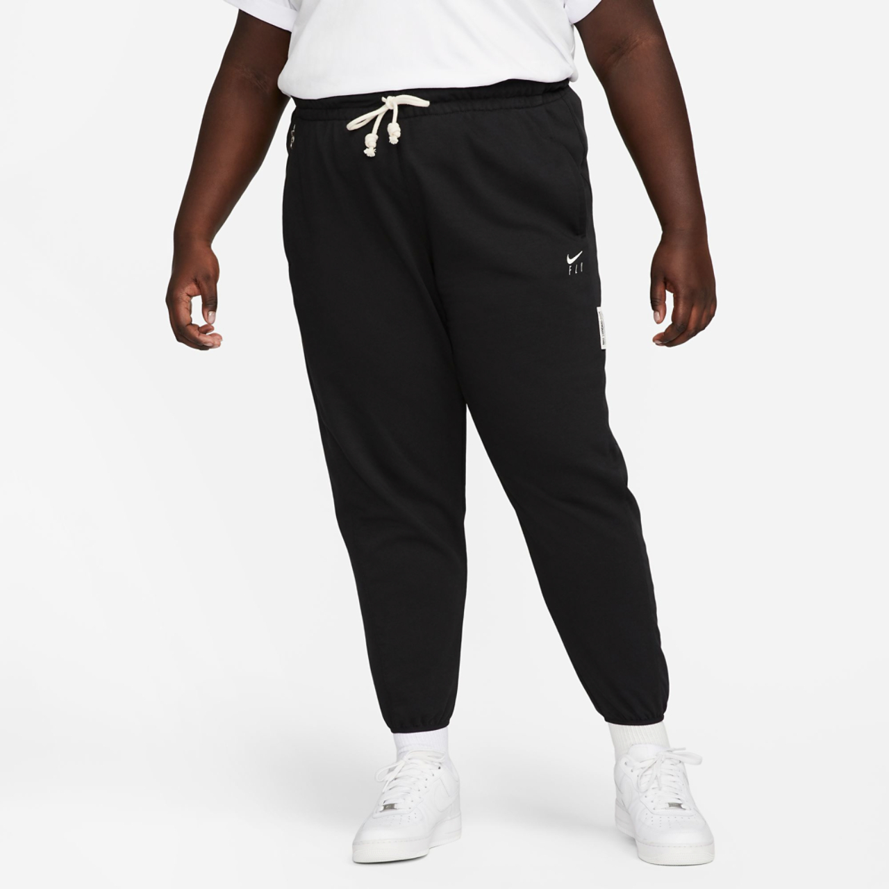 Nike Plus Size Standard Issue Pants Image 1 of 2. Tap to open photo gallery.