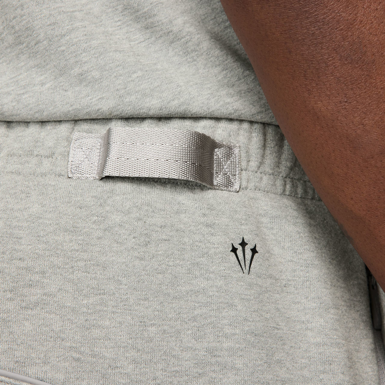 Nike NRG NOCTA Fleece OH Pants Image 4 of 5. Tap to open photo gallery.